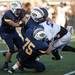 Ann Arbor Pioneer senior running back Zachary Davis is stopped by the Saline defense in the first quarter on Friday. Pioneer won 7-6. Daniel Brenner I AnnArbor.com